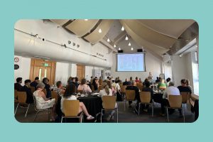Image shows a healthcare professional audience observing a presentation at a PRDA professional networking event